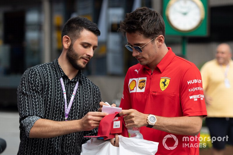 Charles Leclerc, Ferrari signs an autograph for a fan