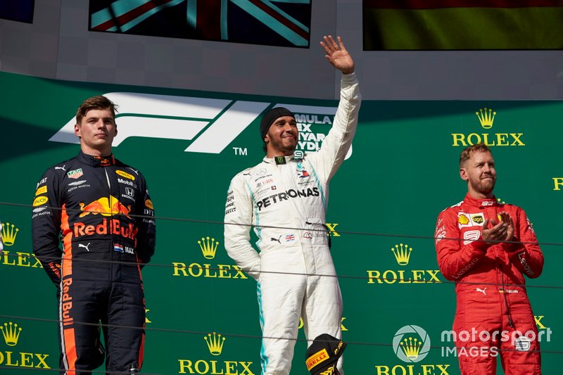 Max Verstappen, Red Bull Racing, 2nd position, Lewis Hamilton, Mercedes AMG F1, 1st position, and Sebastian Vettel, Ferrari, 3rd position, celebrate on the podium