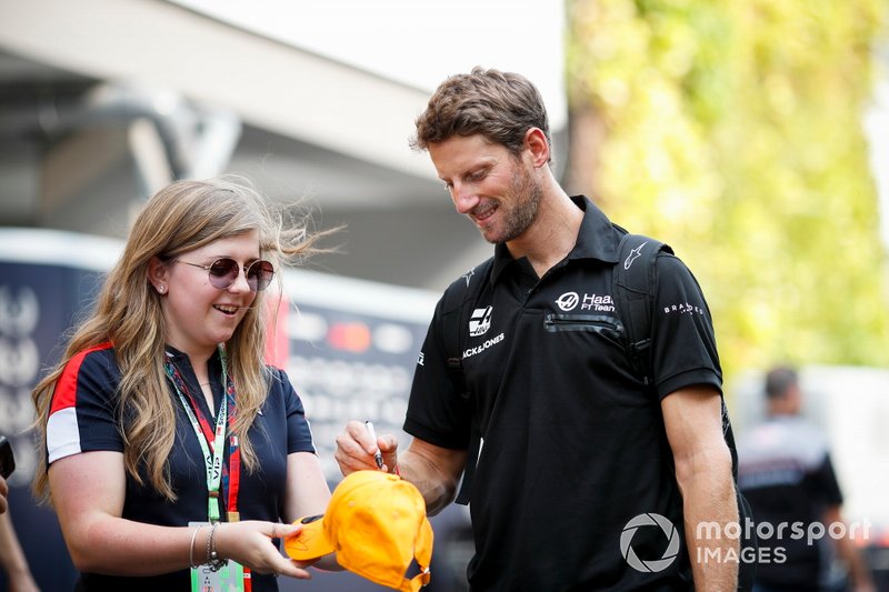 Romain Grosjean, Haas F1 Team signs an autograph for a fan