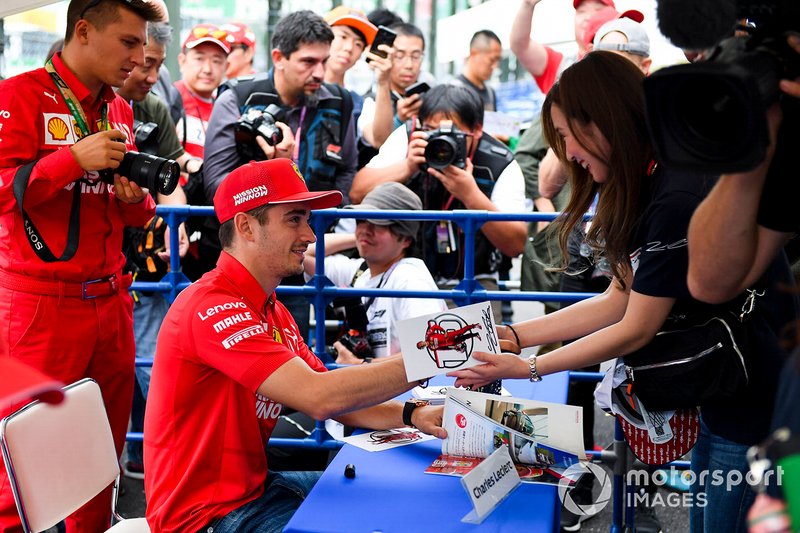 Charles Leclerc, Ferrari signs an autograph for a fan 