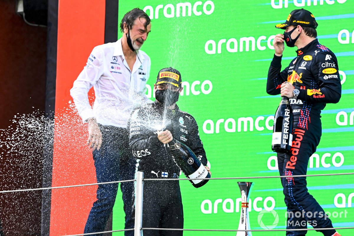 Valtteri Bottas, Mercedes, 3rd position, sprays Champagne from the podium