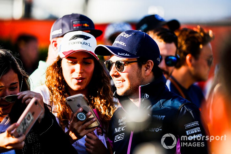 Sergio Perez, Racing Point poses for a seflie with a fan