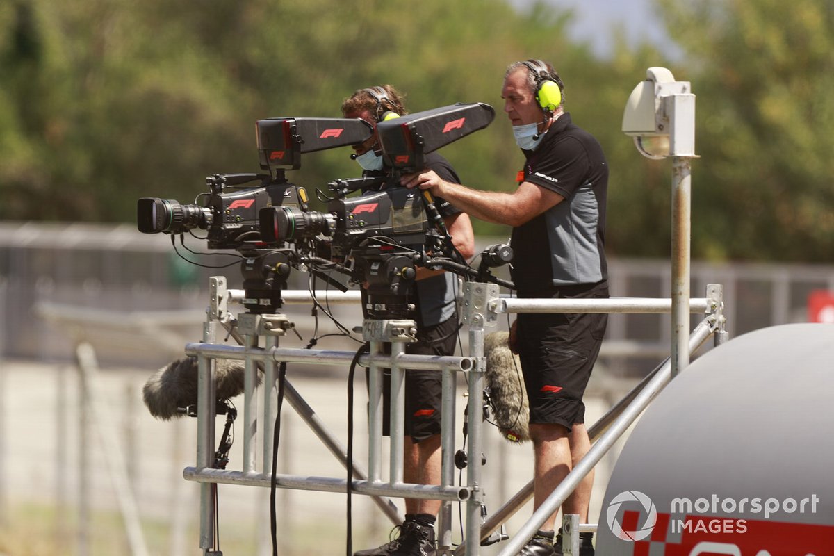 Cameraman filming in the pitlane