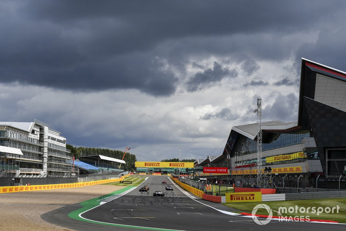 The drivers line up to practice their race start procedures at the end of the session