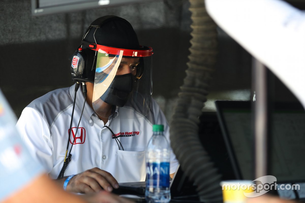 Honda crew member working on an Andretti Autosport car