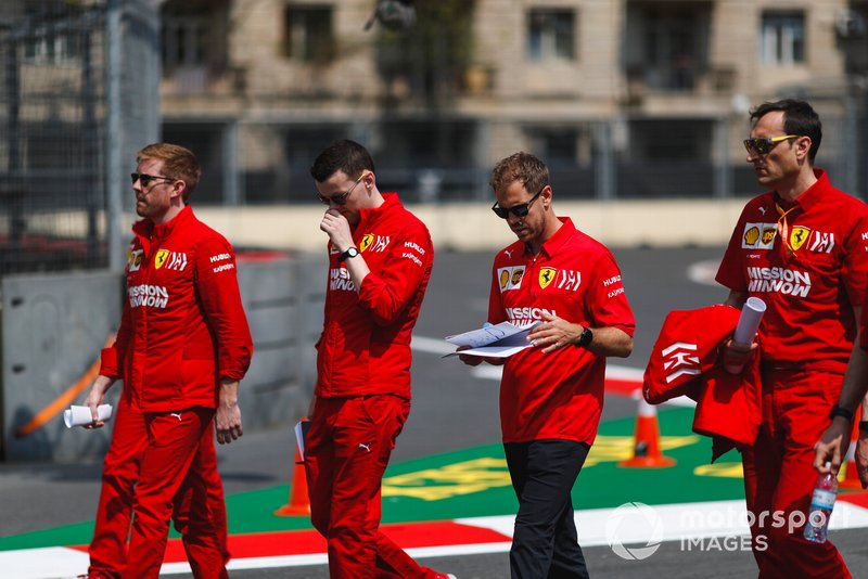 Sebastian Vettel, Ferrari walks the track with his engineers