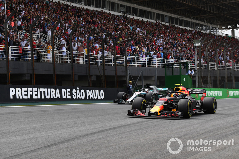 Max Verstappen, Red Bull Racing RB14 passes Lewis Hamilton, Mercedes-AMG F1 W09