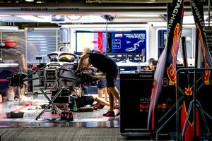 Engineers work on the car of Daniel Ricciardo, Red Bull Racing RB14, in the garage