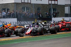 Max Verstappen, Red Bull Racing RB14, leads Romain Grosjean, Haas F1 Team VF-18, Kevin Magnussen, Haas F1 Team VF-18, and Kimi Raikkonen, Ferrari SF71H, at the start