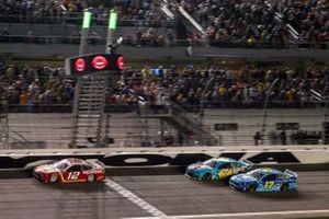 Ryan Blaney, Team Penske, Ford Mustang BodyArmor leads Corey LaJoie, Spire Motorsports, Chevrolet Camaro Built bar and Chris Buescher, Roush Fenway Racing, Ford Mustang Fifth Third Bank on the white flag lap