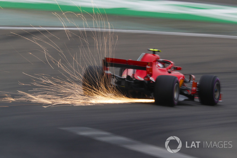 Sparks fly from the car of Kimi Raikkonen, Ferrari SF71H