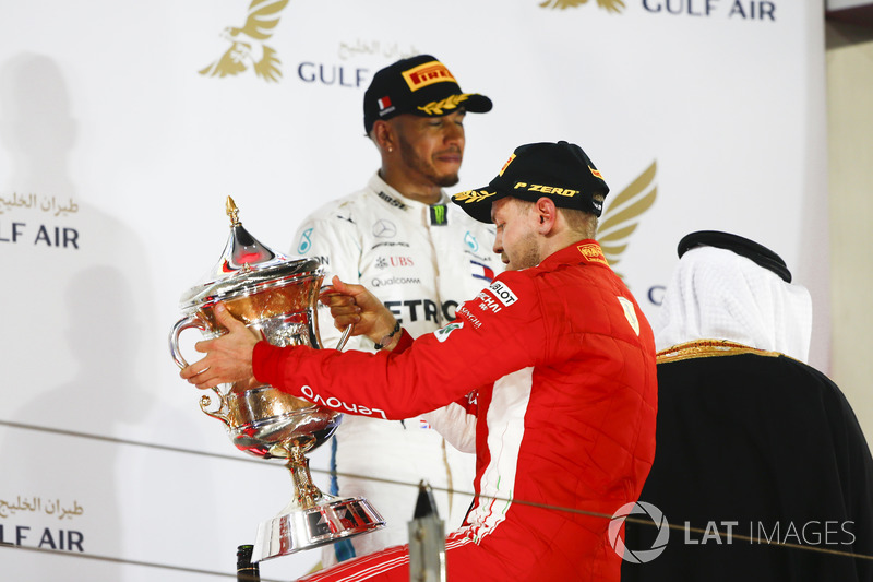 Sebastian Vettel, Ferrari, 1st position, and Lewis Hamilton, Mercedes AMG F1, 3rd position, on the p