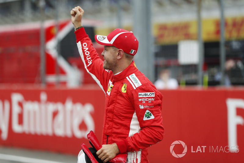 Sebastian Vettel, Ferrari, celebrates his pole position