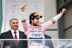 Sergio Perez, Force India, 3rd position, celebrates as he arrives on the podium