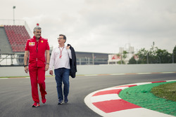 Maurizio Arrivabene, Ferrari Team Principal and Louis Camilleri, Chairman of Philip Morris walk the track