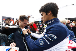 Lance Stroll, Williams Racing, signs autographs for fans