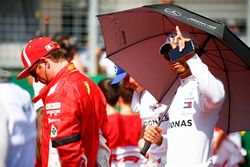 Kimi Raikkonen, Ferrari, and Lewis Hamilton, Mercedes AMG F1, on the grid