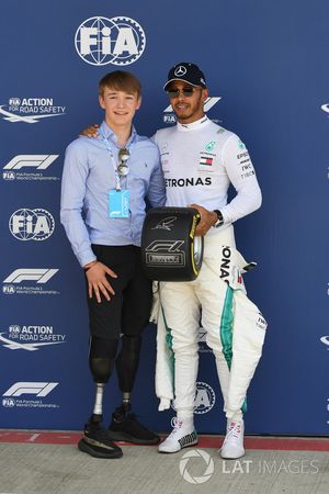 Lewis Hamilton, Mercedes-AMG F1 receives the Pirelli Pole Position Award from Billy Monger