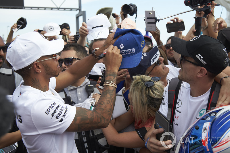 Lewis Hamilton, Mercedes AMG F1, signs autographs for fans