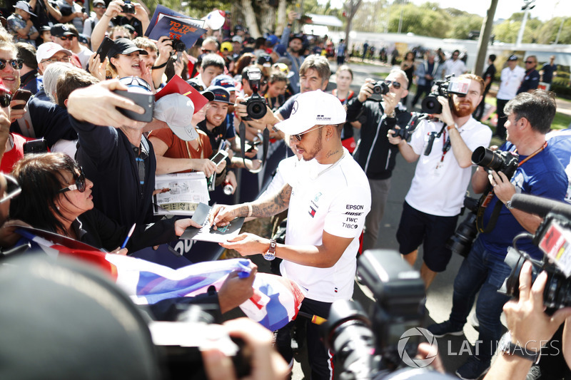 Lewis Hamilton, Mercedes AMG F1, signs autographs for fans