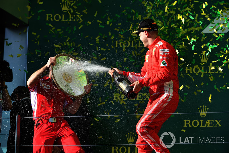 Race winner Sebastian Vettel, Ferrari celebrates with the champagne on the podium