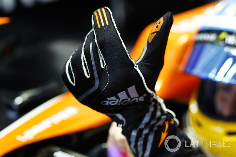 Fernando Alonso, McLaren, pulls on his gloves