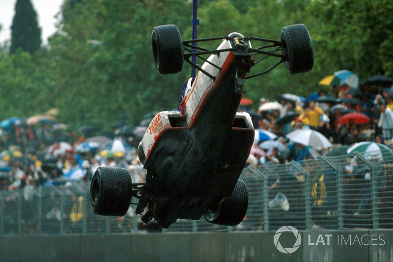 Piercarlo Ghinzani, Osella FA1-M89 car is removed after a shunt with Nelson Piquet