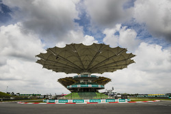 A covered grandstand at the final corner