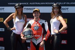 Polesitter P.J. Jacobsen, MV Agusta with lovely Tissot girls