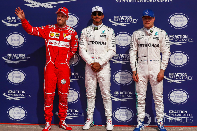 Sebastian Vettel, Ferrari, Polesitter Lewis Hamilton, Mercedes AMG F1 and Valtteri Bottas, Mercedes AMG F1 celebrate in parc ferme
