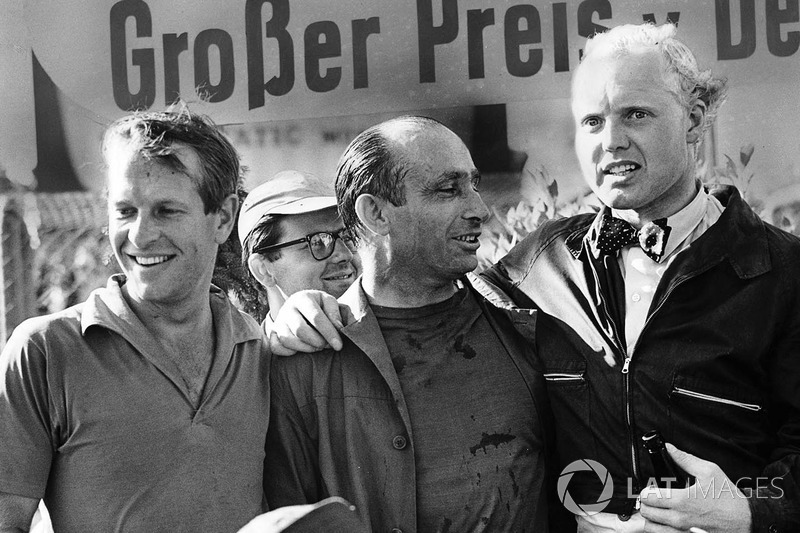 Podium: race winner Juan Manuel Fangio, Maserati, second place Mike Hawthorn, Lancia Ferrari, third