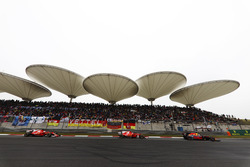 Daniel Ricciardo, Red Bull Racing RB13, leads Kimi Raikkonen, Ferrari SF70H, and Sebastian Vettel, Ferrari SF70H