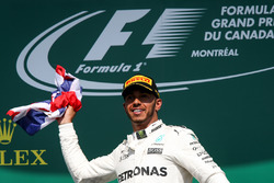 Race winner Lewis Hamilton, Mercedes AMG F1 celebrates on the podium, the Union Jack Flag