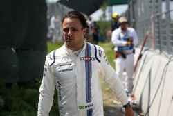 Race retiree Felipe Massa, Williams walks back after after crashing out of the race