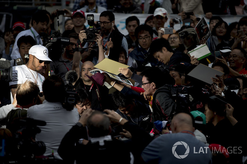 Lewis Hamilton, Mercedes AMG F1, signs autographs for fans