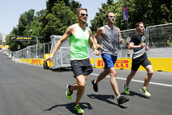 Jenson Button, McLaren, runs the circuit with Stoffel Vandoorne, McLaren Test and Reserve Driver