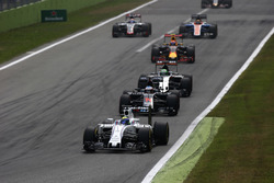 Felipe Massa, Williams FW38 Mercedes, leads Fernando Alonso, McLaren MP4-31 Honda, Nico Hulkenberg, Force India VJM09 Mercedes, and Max Verstappen, Red Bull Racing RB12 TAG Heuer