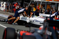 Felipe Massa, Williams FW38 Mercedes, is returned to the garage by engineers