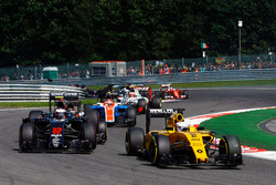 Kevin Magnussen, Renault Sport F1 Team RS16 leads Jenson Button, McLaren MP4-31 as he is hit by Pasc