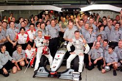 The McLaren team celebrate winning the Constructors Championship with the new World Champion Mika Hakkinen