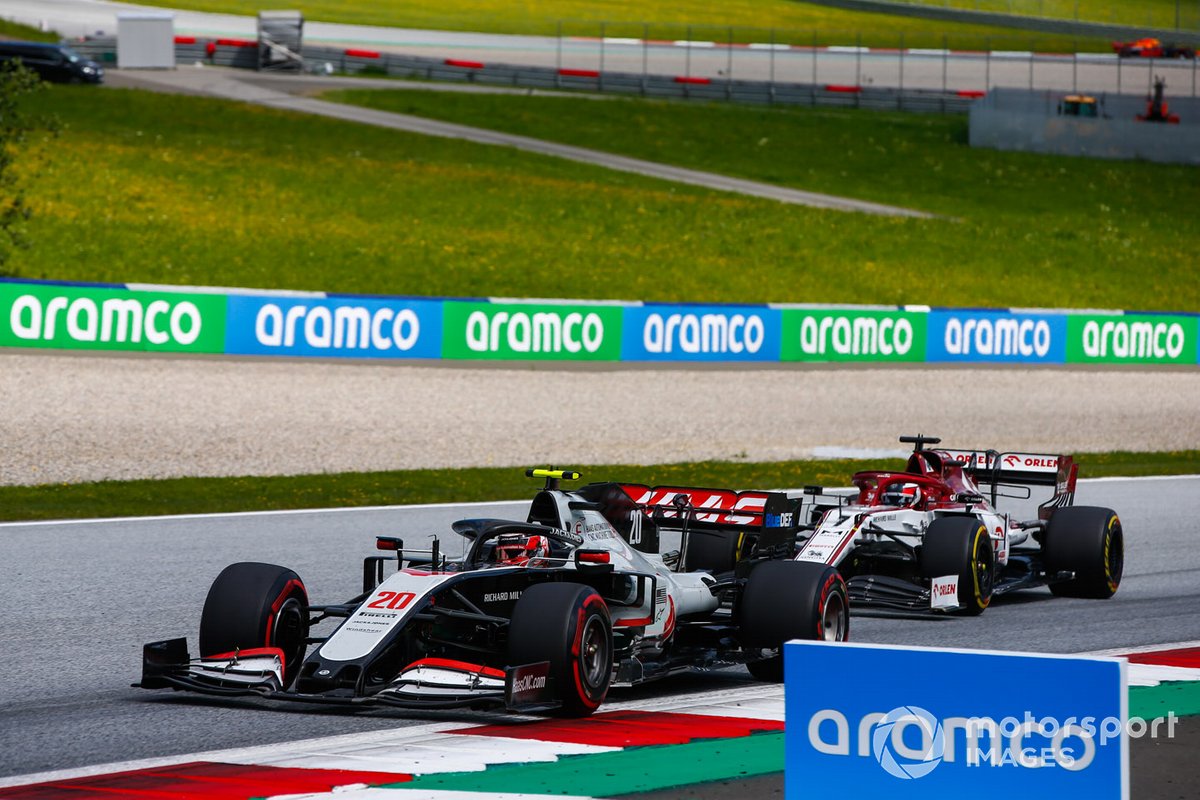 Kevin Magnussen, Haas VF-20, leads Kimi Raikkonen, Alfa Romeo Racing C39