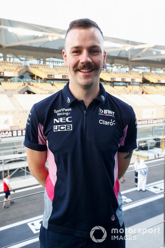 A Movember prize is awarded to a Racing Point team member