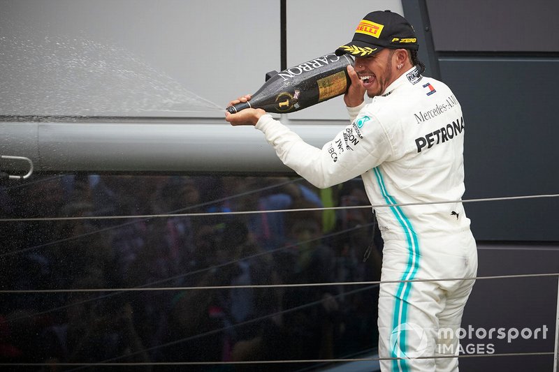 Lewis Hamilton, Mercedes AMG F1, 1st position, sprays Champagne from the podium