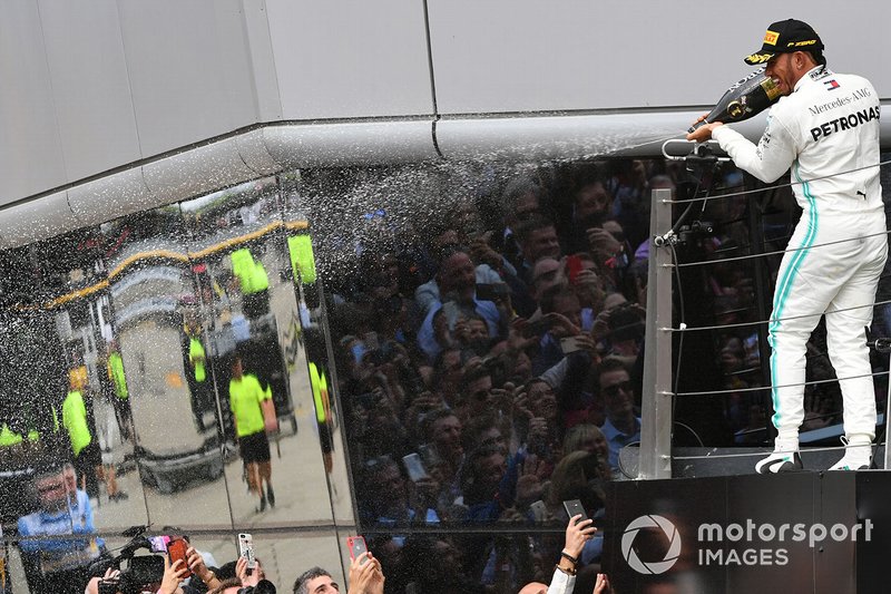 Lewis Hamilton, Mercedes AMG F1, 1st position, sprays Champagne from the podium