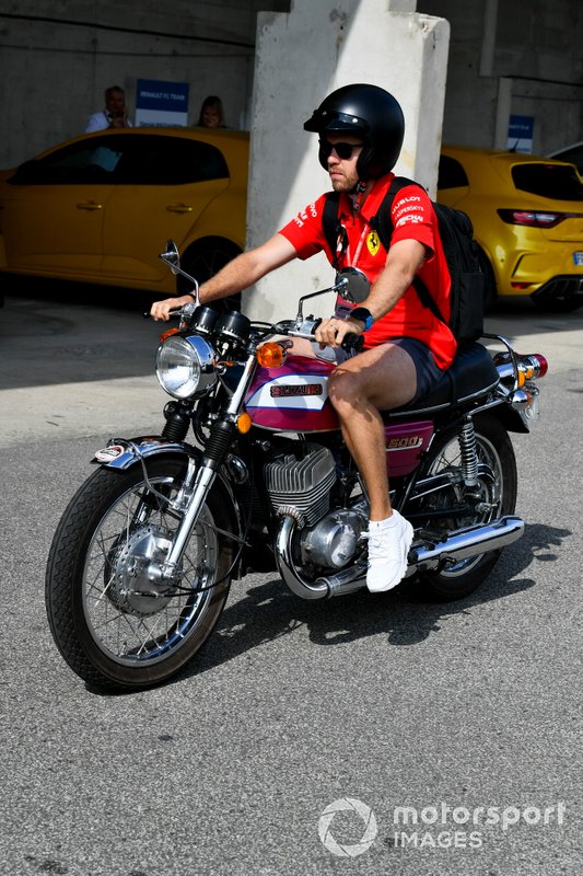 Sebastian Vettel, Ferrari arrives on his motorbike