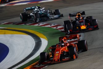 Sebastian Vettel, Ferrari SF90, leads Max Verstappen, Red Bull Racing RB15, and Valtteri Bottas, Mercedes AMG W10