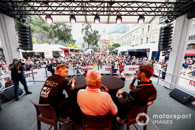 Kevin Magnussen, Haas F1 and Romain Grosjean, Haas F1 on stage in the fan zone