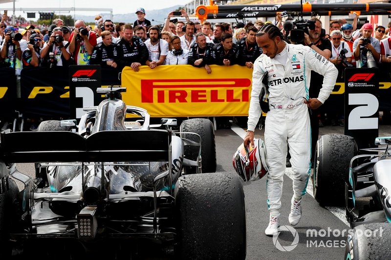 Lewis Hamilton, Mercedes AMG F1, 1st position, inspects his car in Parc Ferme