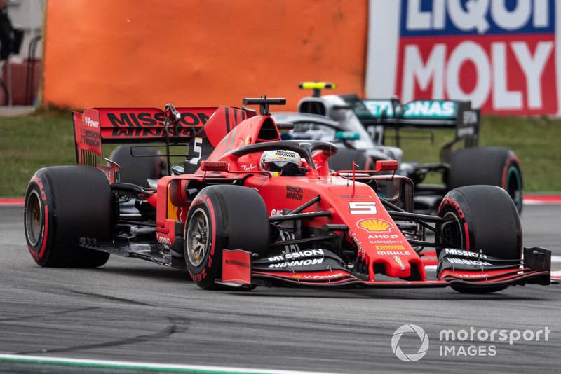 Sebastian Vettel, Ferrari SF90, leads Valtteri Bottas, Mercedes AMG W10
