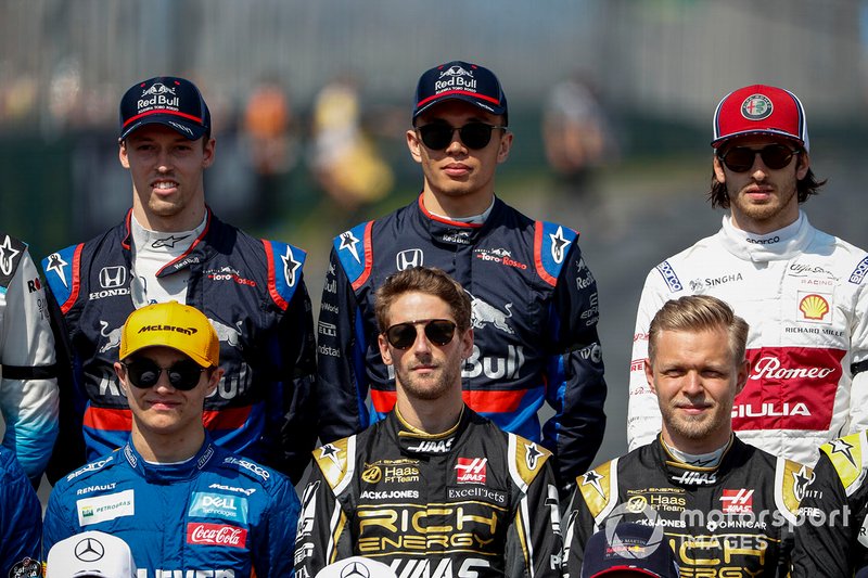 Daniil Kvyat, Toro Rosso, Alexander Albon, Toro Rosso and Antonio Giovinazzi, Alfa Romeo Racing stand behind Lando Norris, McLaren, Romain Grosjean, Haas F1 and Kevin Magnussen, Haas F1